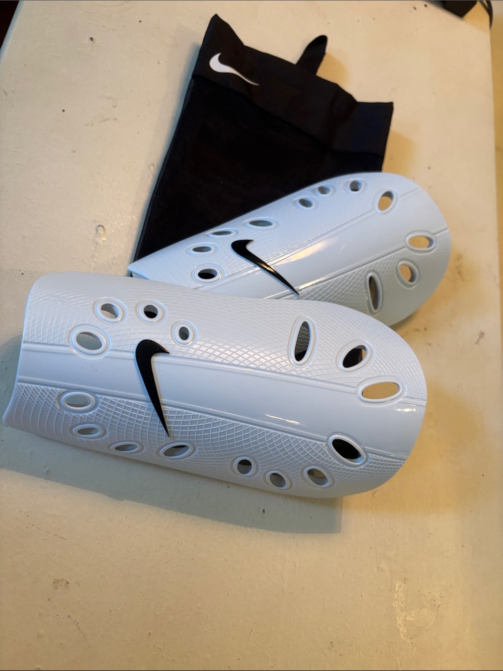 Nike White Shin Guards with Black Swoosh
